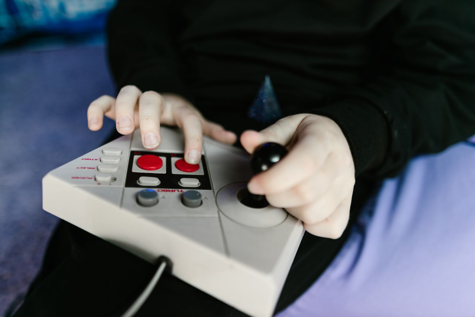 Hands on a retro joystick